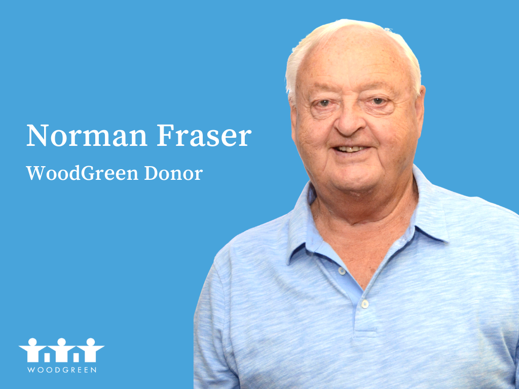 an older man in a blue shirt on a blue background