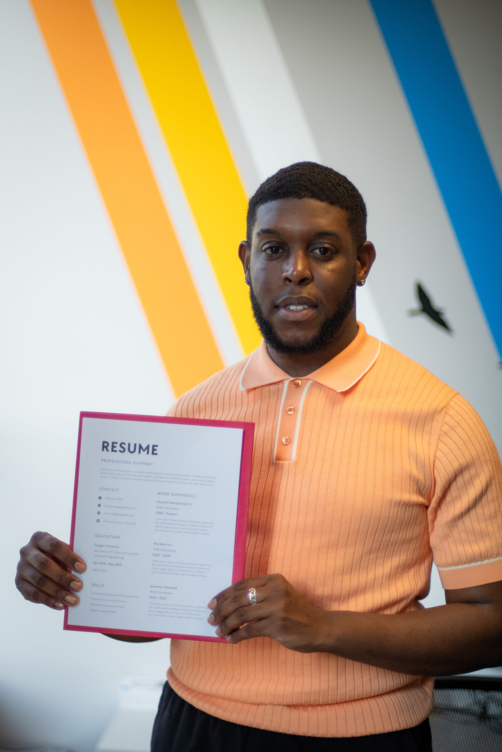 Young black man holding his resume