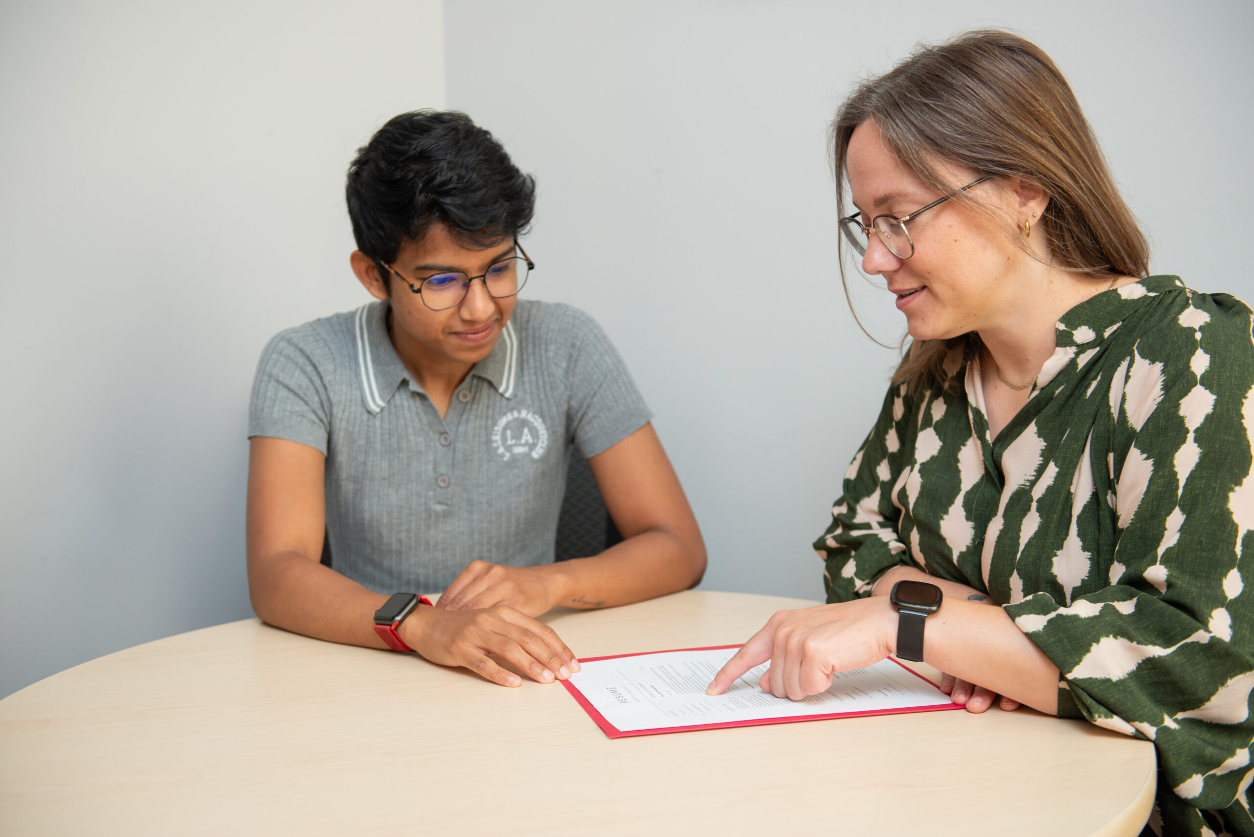 WoodGreen staff person reviews the resume of a young person