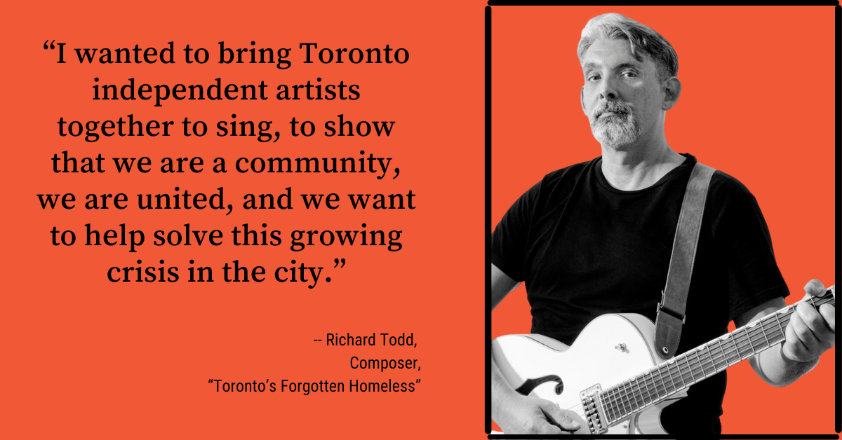 Singer songwriter Richard Todd wears a black shirt and plays a white guitar with a quote about Toronto's homeless population