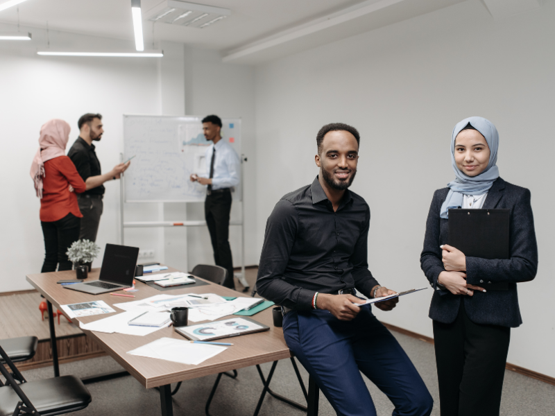 Stock image featuring employees in a meeting room.