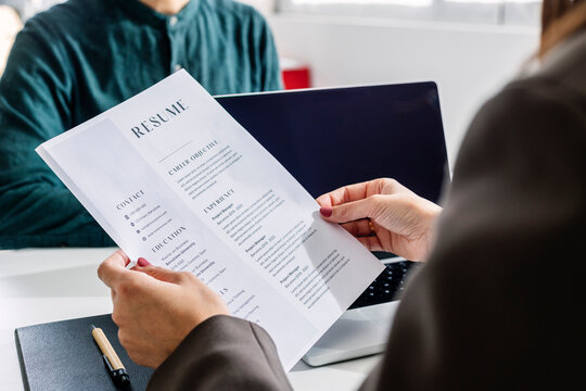 Person holding a resume