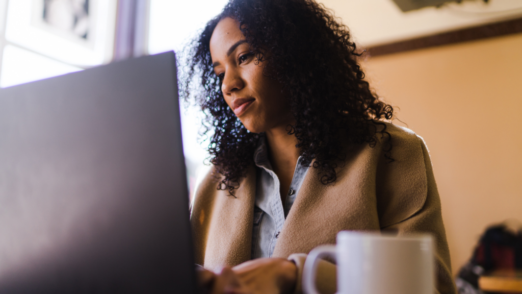 Black woman working on a laptop