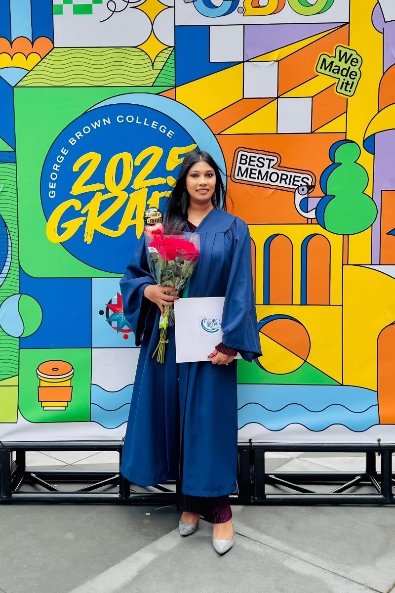 Nayab celebrating her graduation from George Brown College with flowers and a diploma