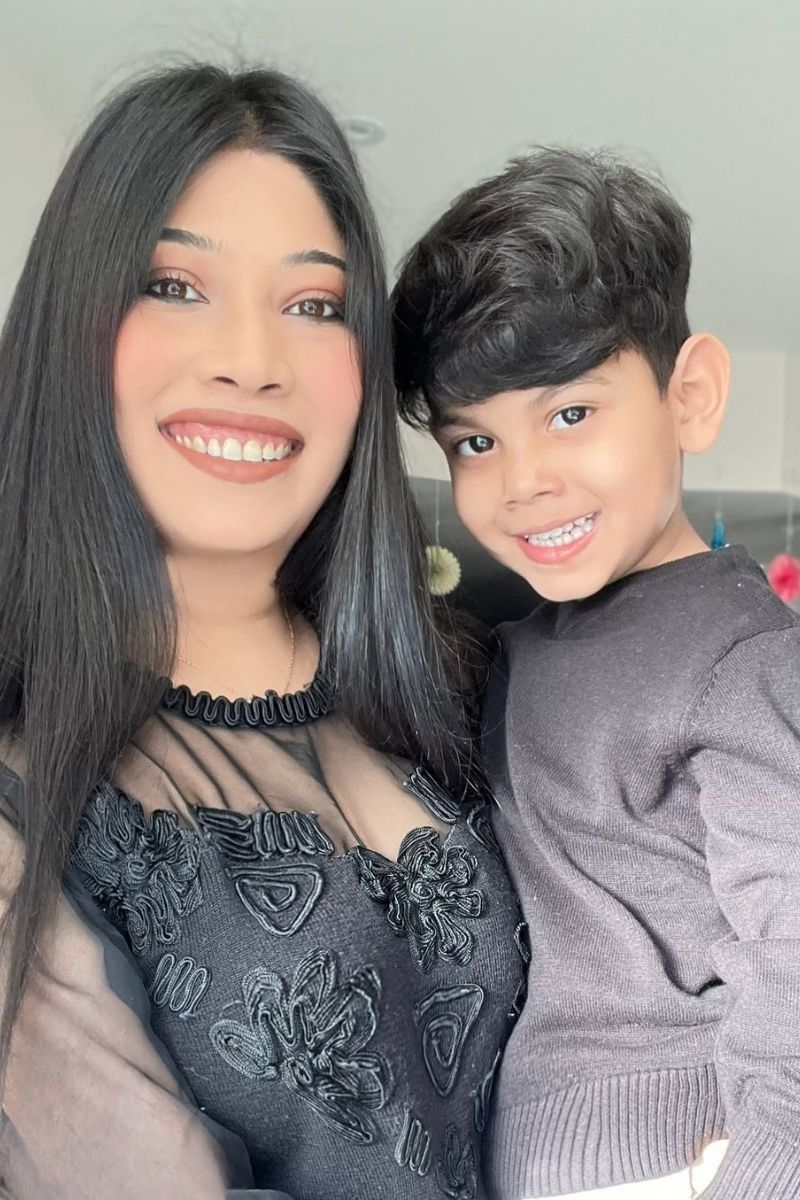 Nayab smiling alongside her young son Ibrahim